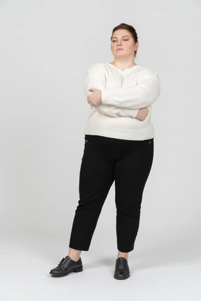 Confident plump woman in casual clothes
