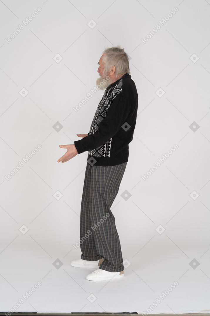 Side view of old man with spread arms