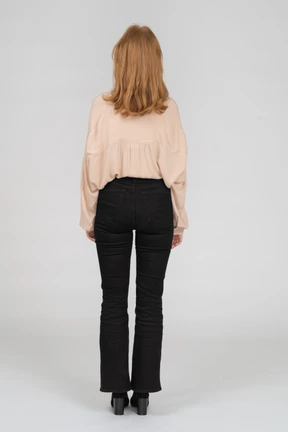Back view of young woman standing