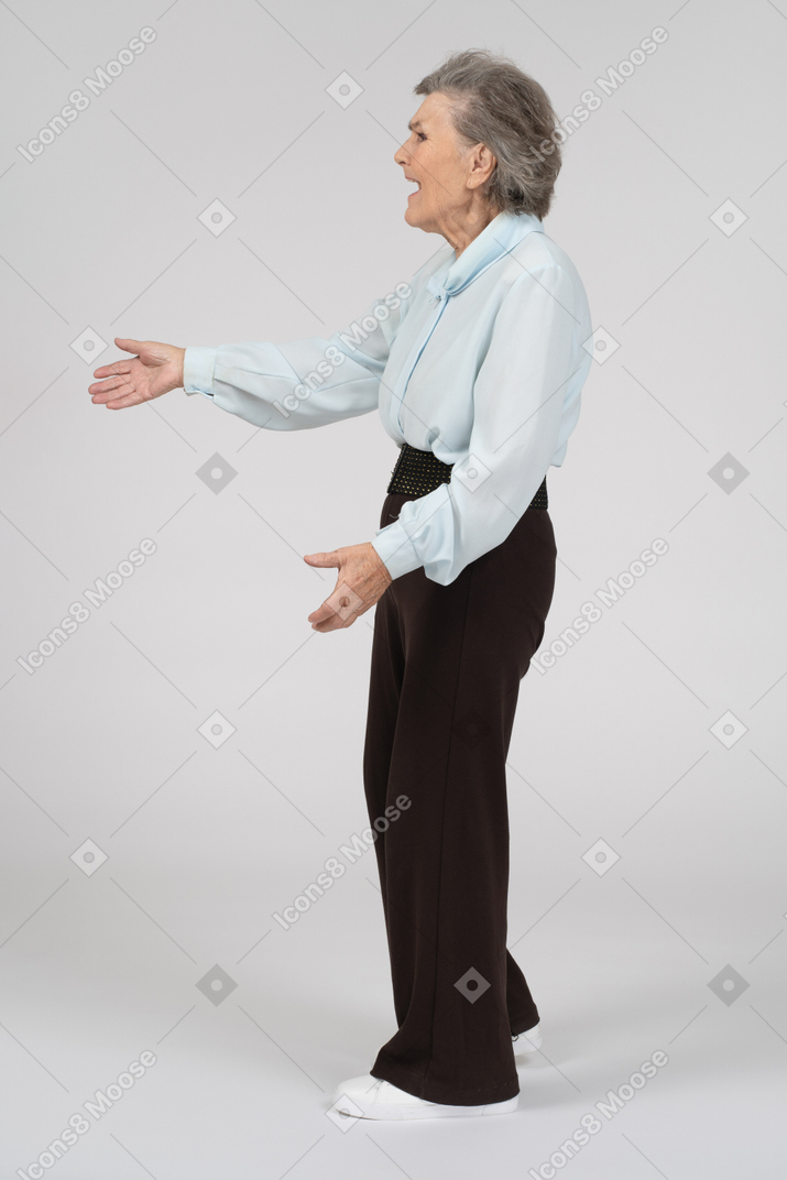 Side view of an old woman gesturing