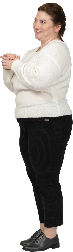 Side view of a happy plump woman in casual clothes