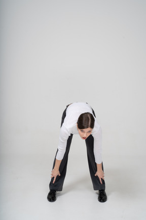 Front view of a woman bending down