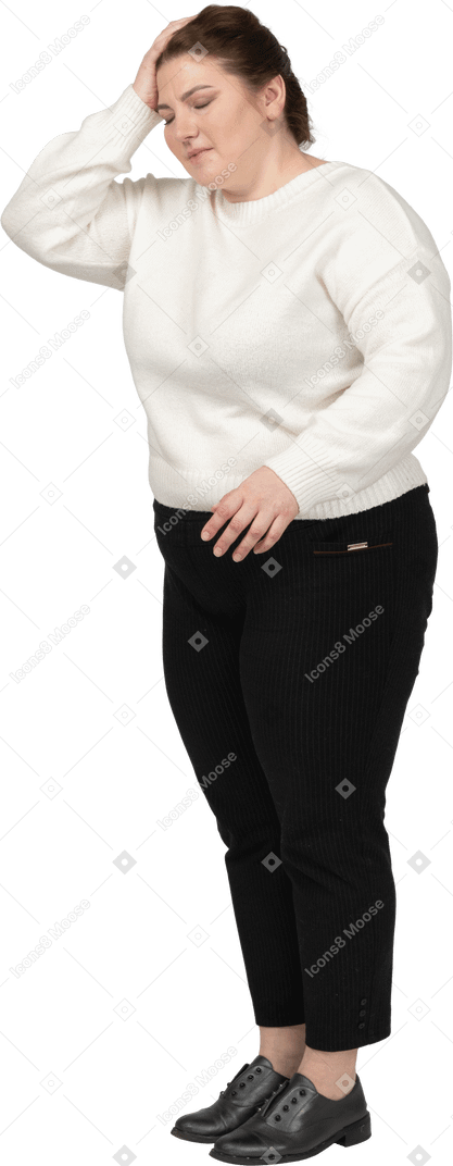 Plump woman in casual clothes suffering from headache