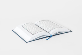 Open koran book on white background