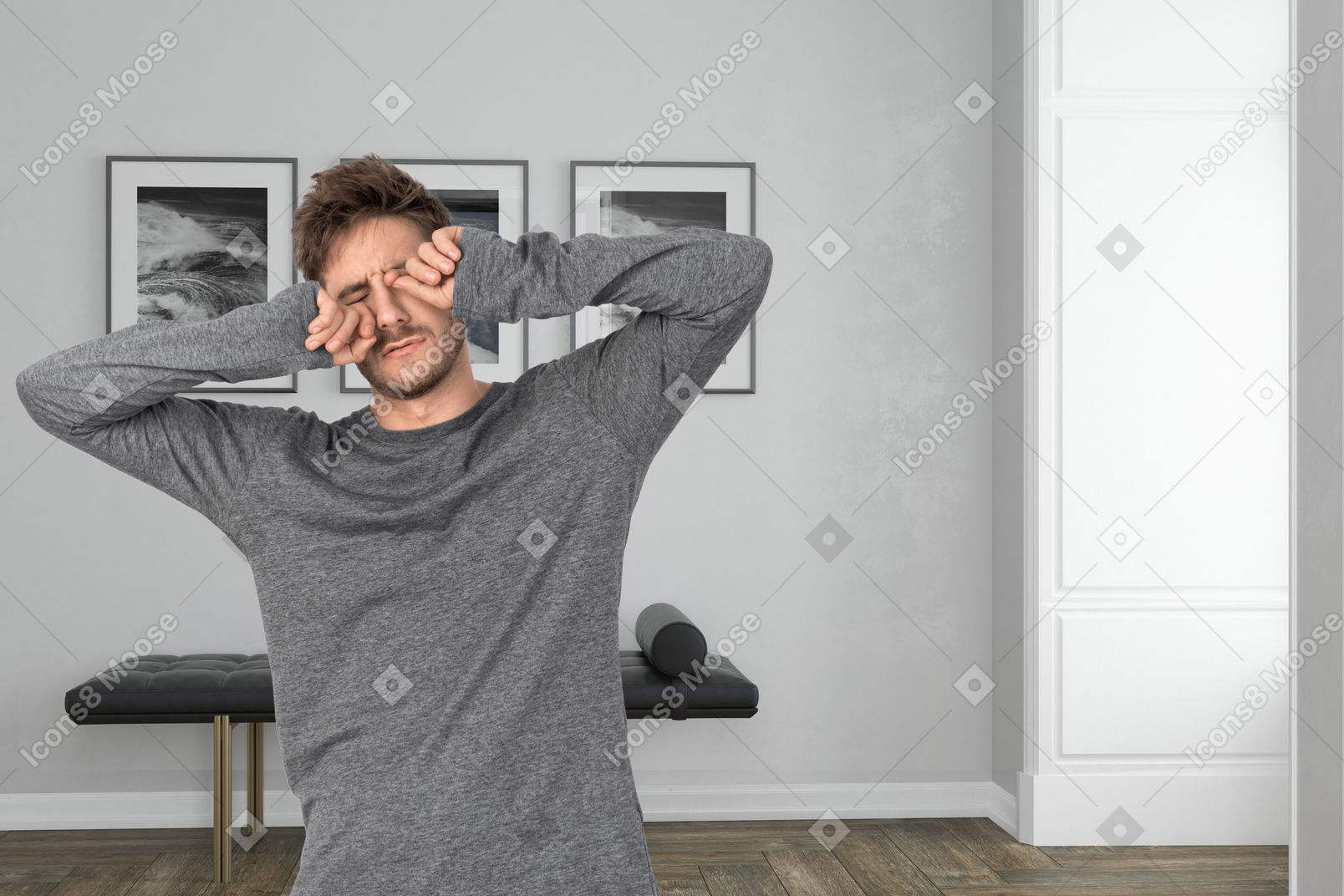 Tired young man rubbing his eyes