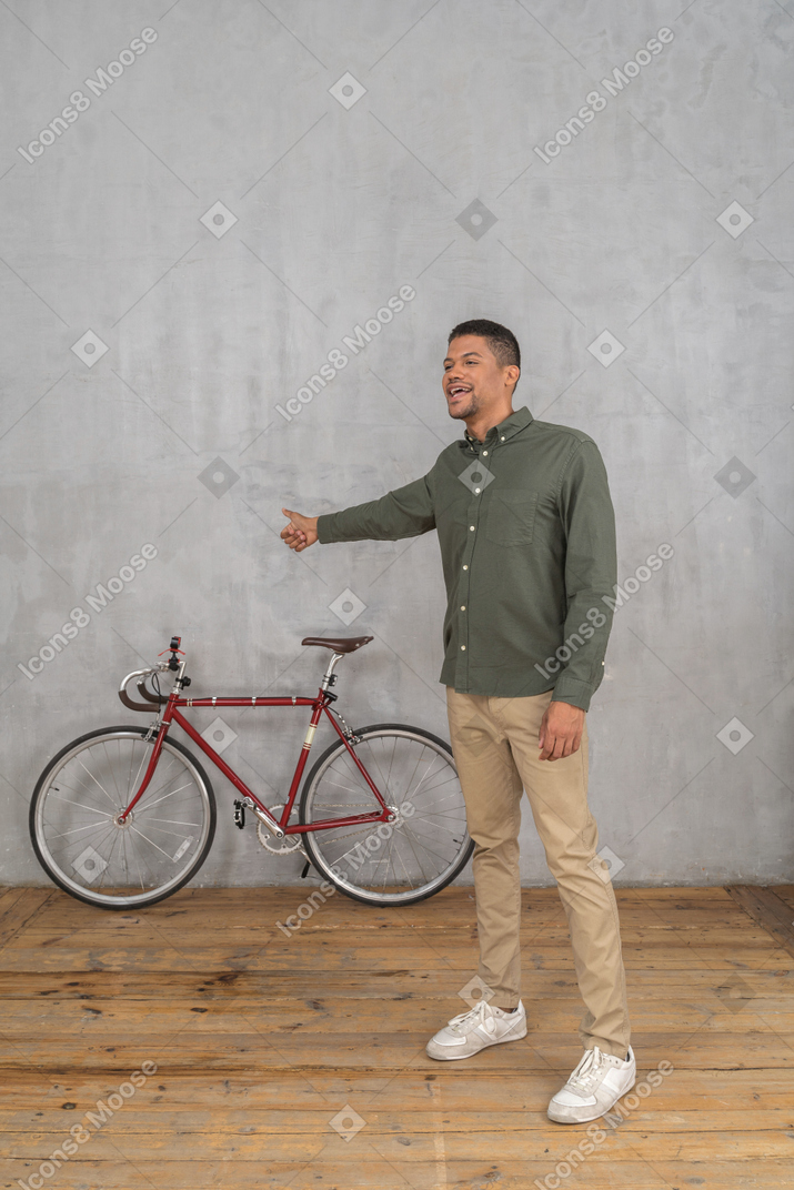 Smiling man in casual clothes looking for a ride