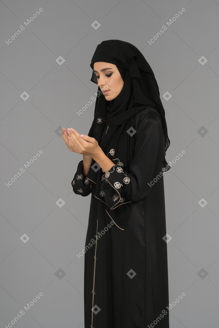 A muslim woman making dua