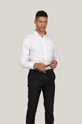 A man in a white shirt and black pants