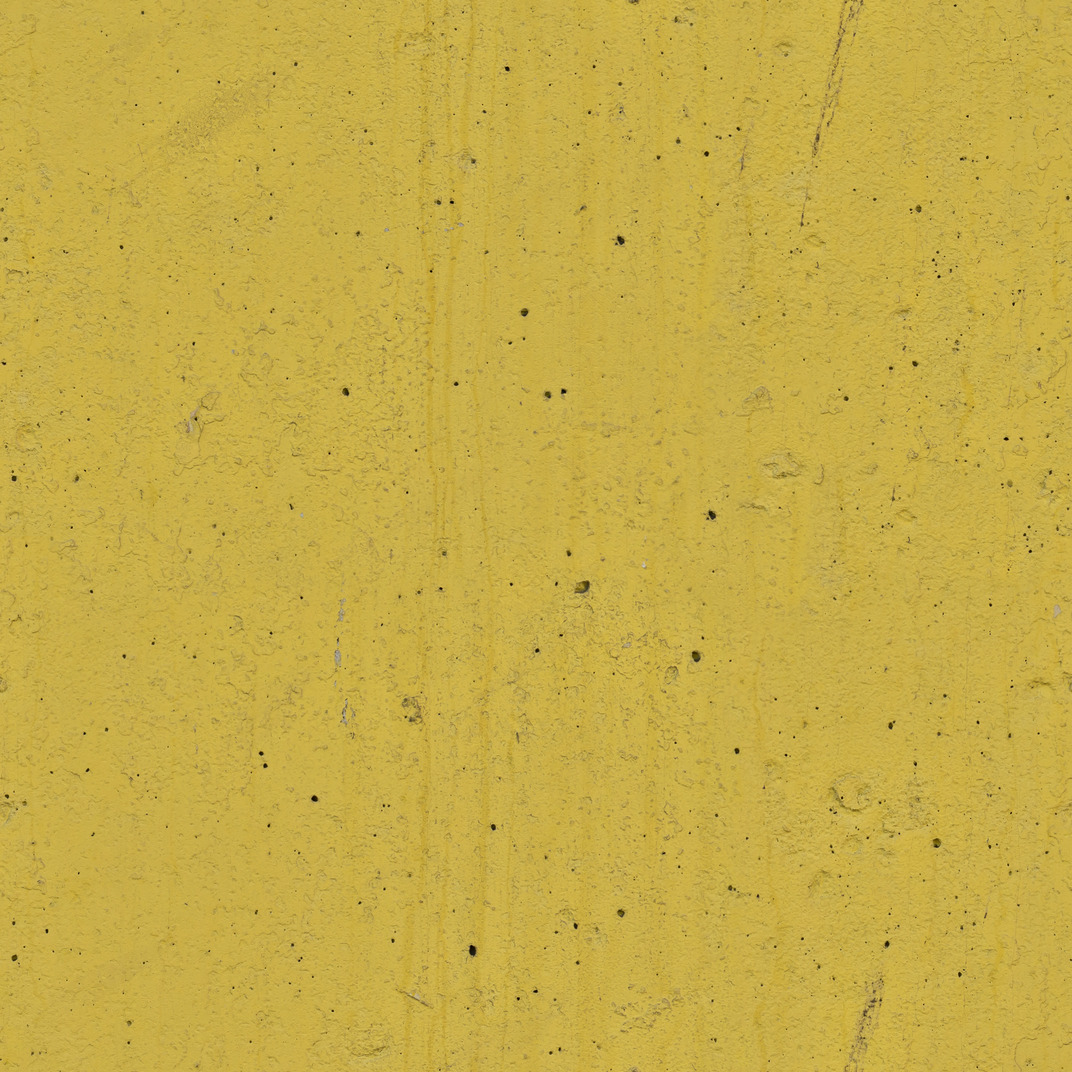 Concrete wall painted yellow