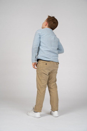 Back view of a boy suffering from stomachache