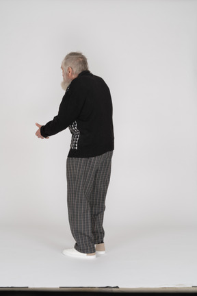 Back view of old man gesturing