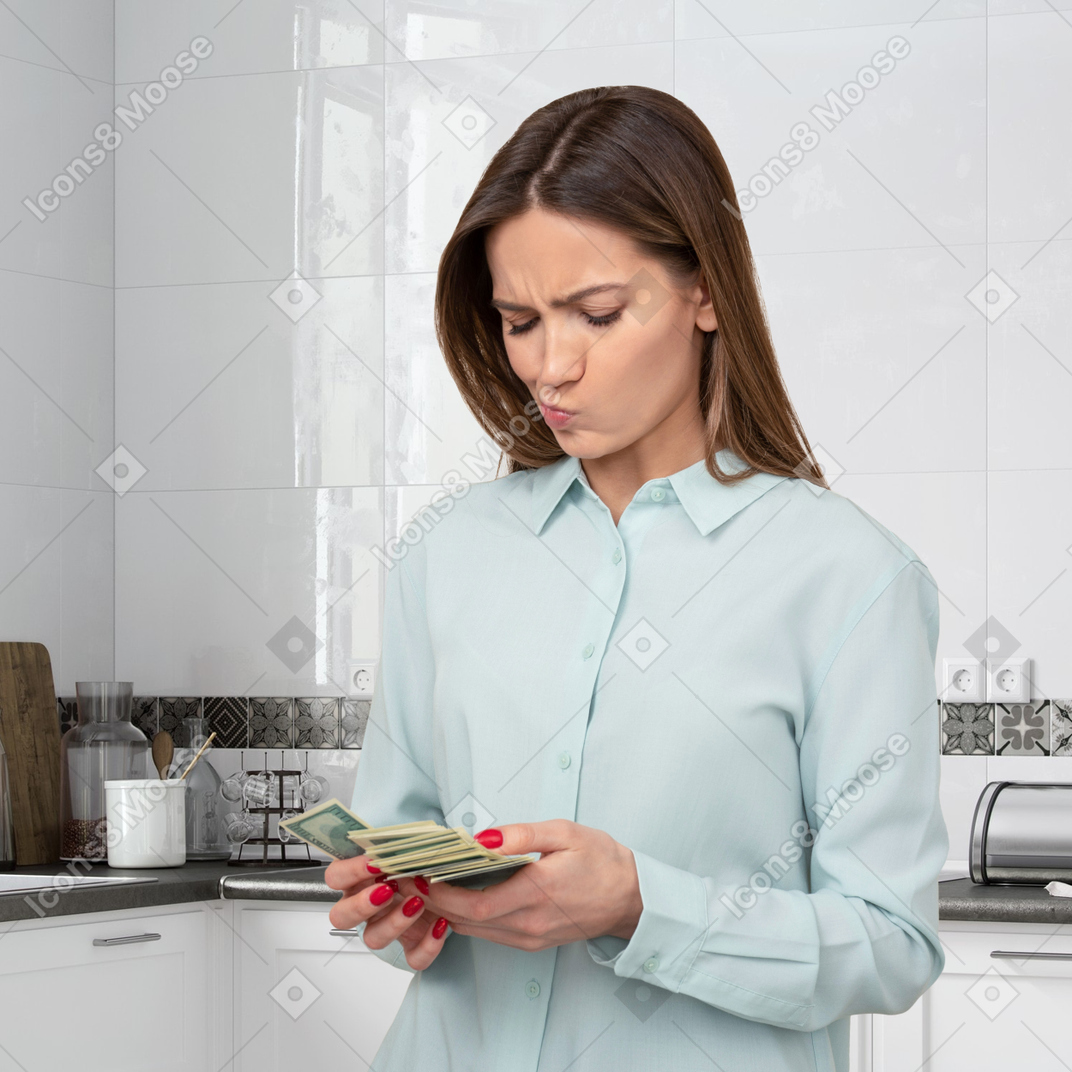 A young woman counting money