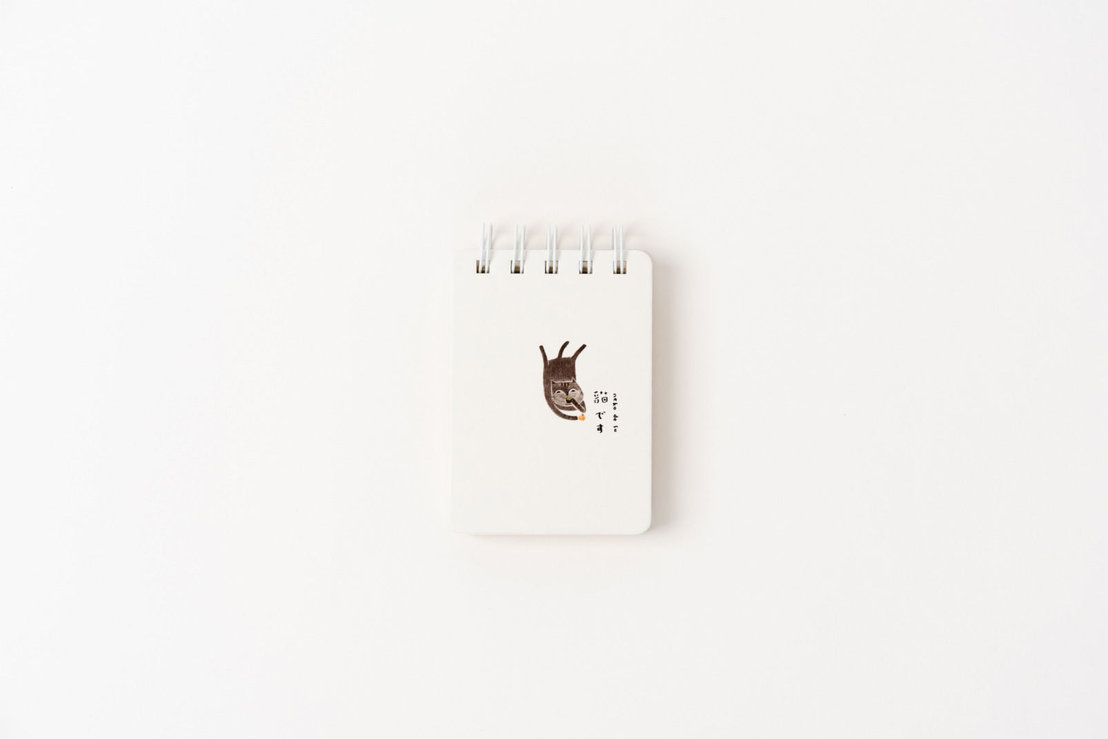 White notebook with picture on it