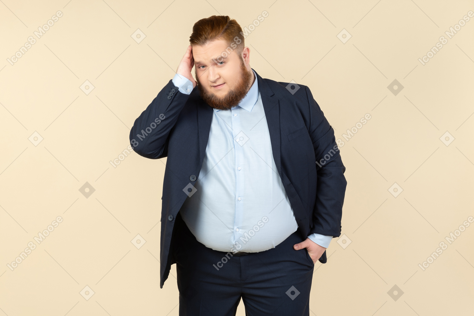 Young overweight man in suit touching head and holding one hand in pocket