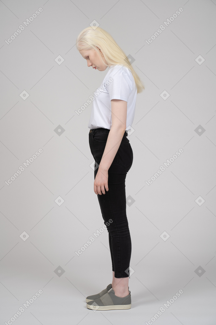 Side view of a teenage girl with her head down