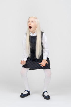 Schoolgirl looking shocked with her mouth wide open