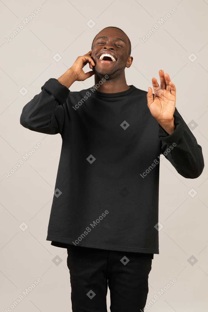 Laughing man talking on the phone and gesturing