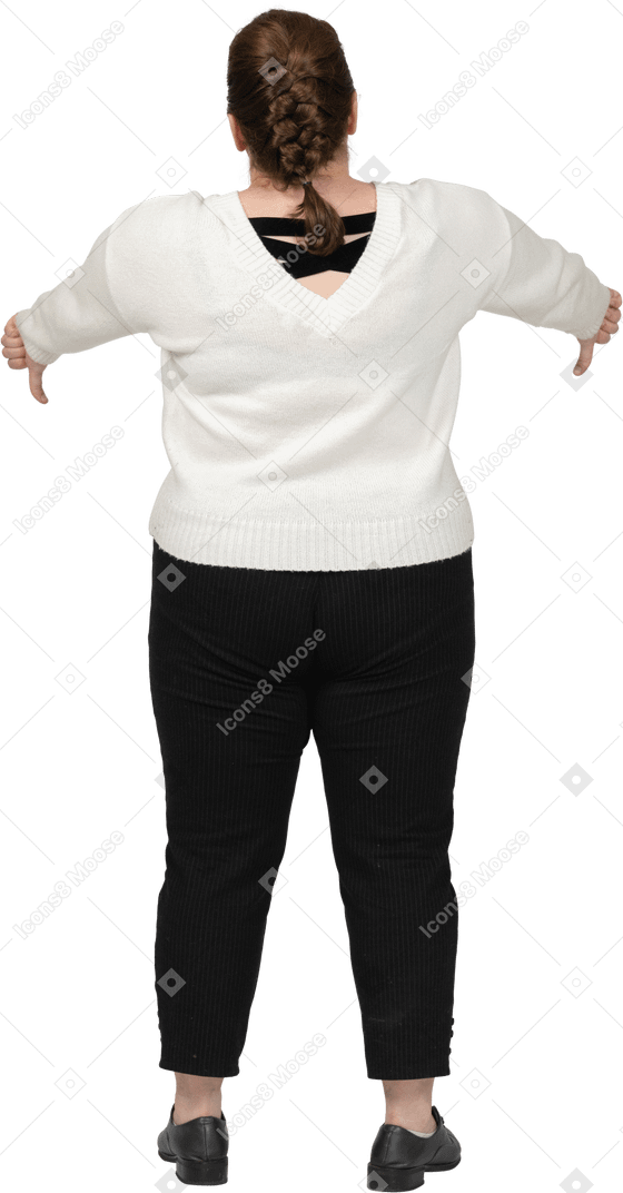 Plus size woman in casual clothes showing thumbs down