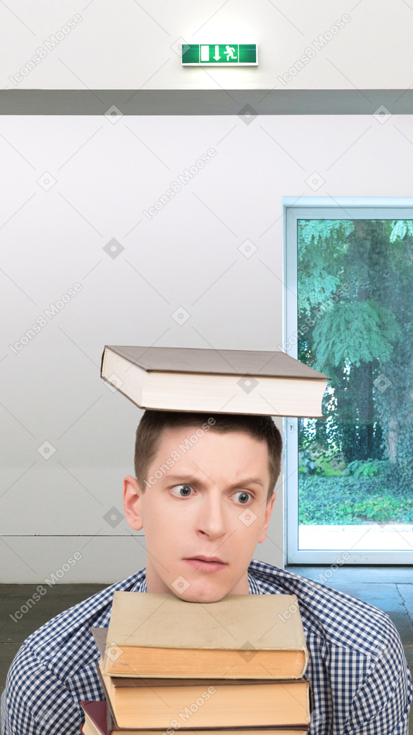 A man in a cap and gown holding a box