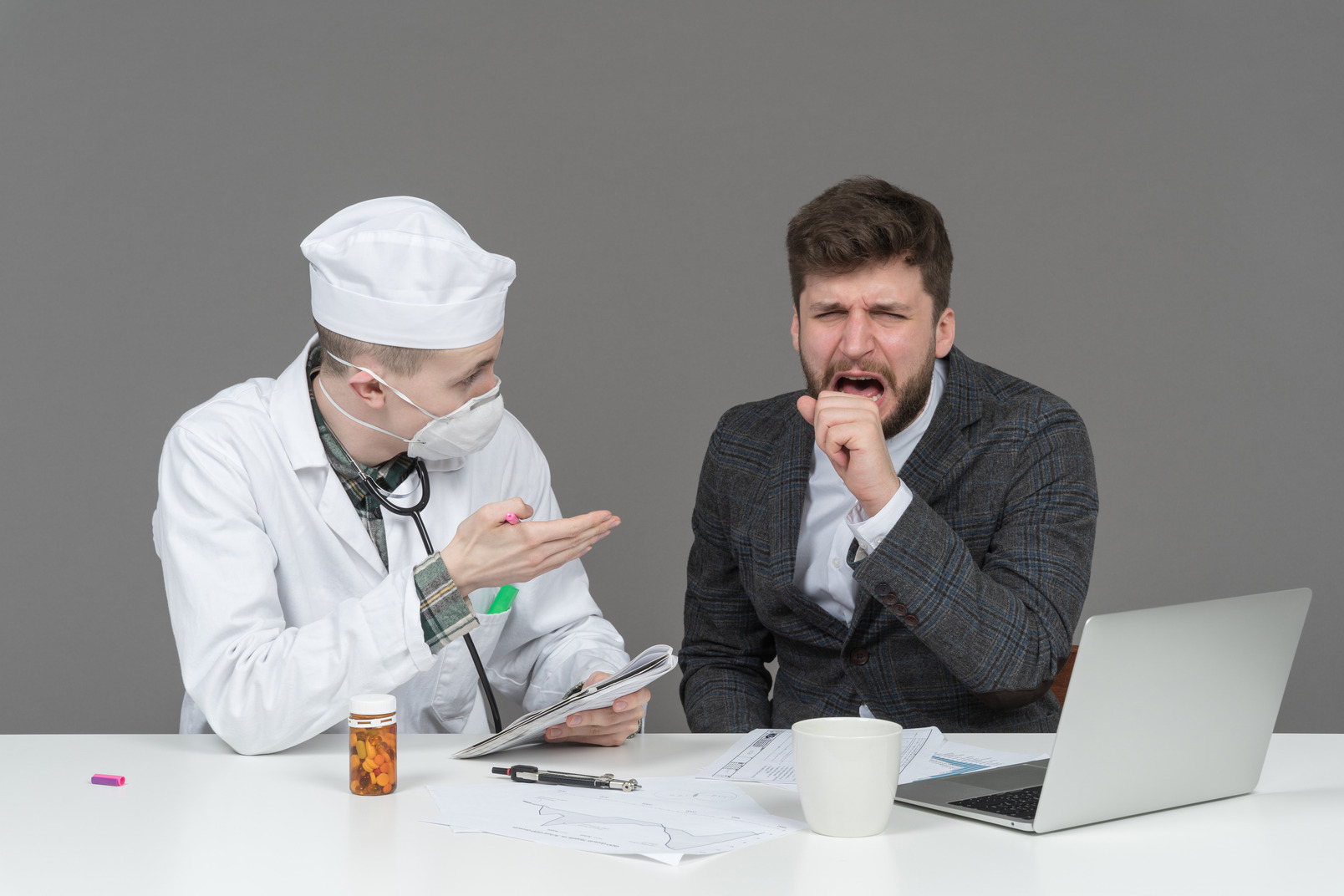 A doctor talking to a coughing patient