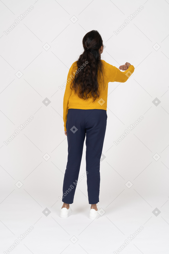 Rear view of a girl in casual clothes making welcoming gesture