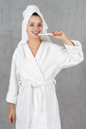 Woman in bathrobe showing off her hollywood smile