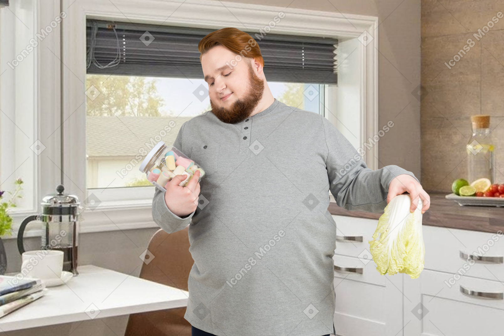 Man holding a cabbage and looking lovingly at a jar of sweets