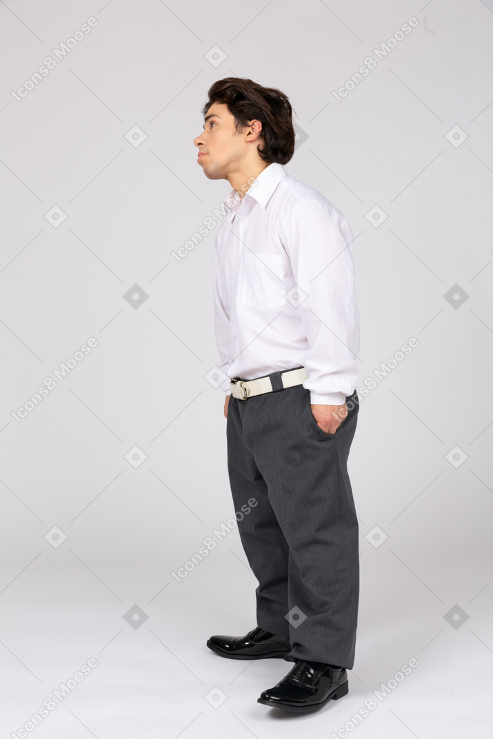 Side view of a male office worker looking up