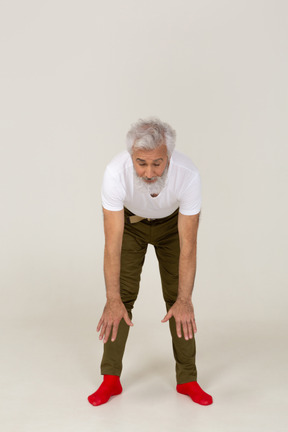 Front view of a man doing bending exercises