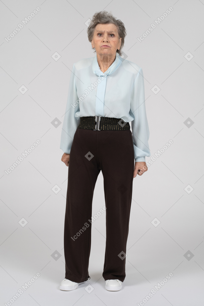 Front view of an old woman pouting intensely