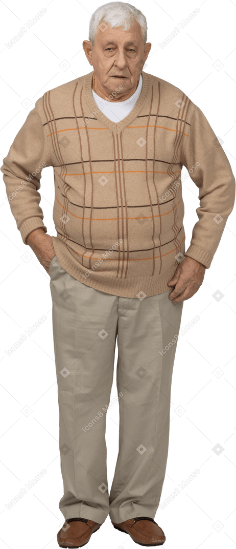 Front view of an old man in casual clothes posing with hand in pocket