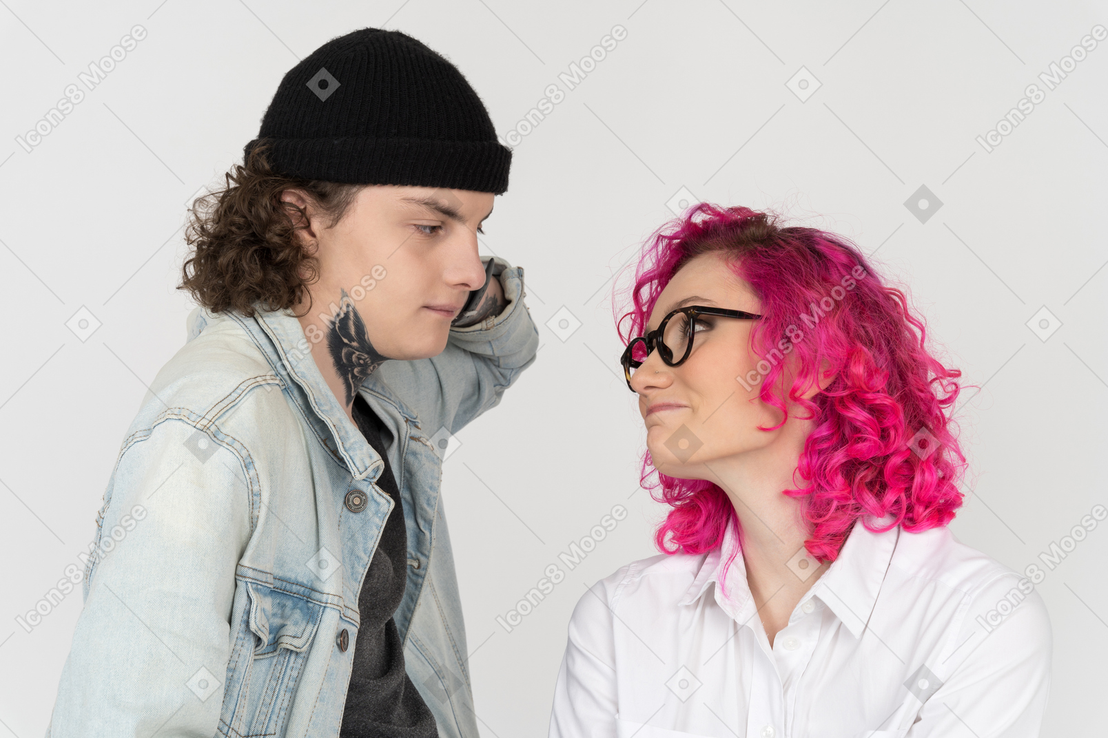 Young man and woman watching each other with a shy
