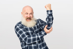 Angry bearded man making a rude gesture