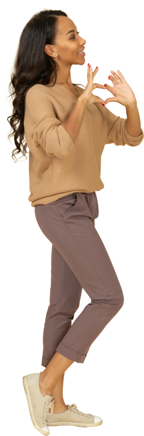 Side view of a dark-skinned young female showing heart gesture