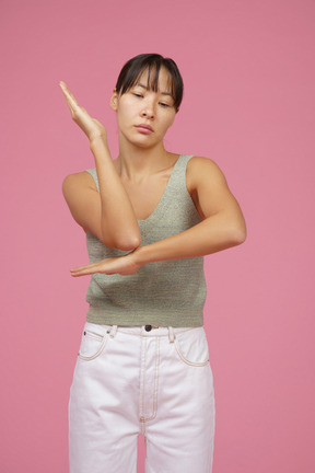 Young woman raising arm