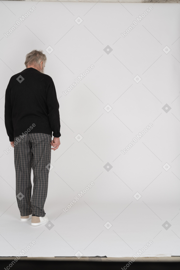 Old man standing back to camera