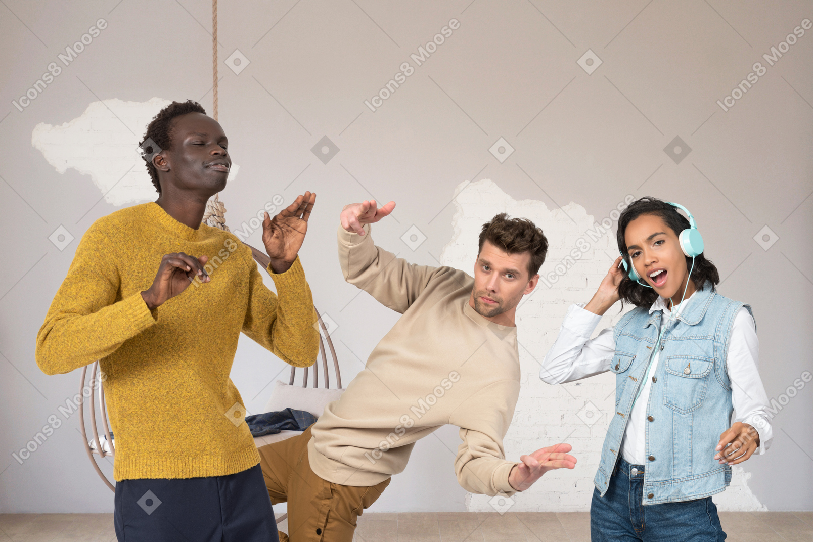 A group of young multicultural friends dancing to the music together in the bright minimalistically styled room
