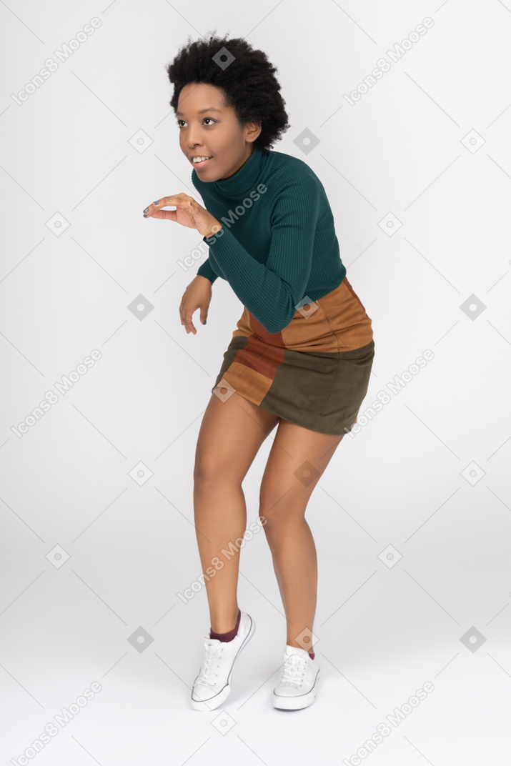 Cheerful slim african girl practicing martial arts