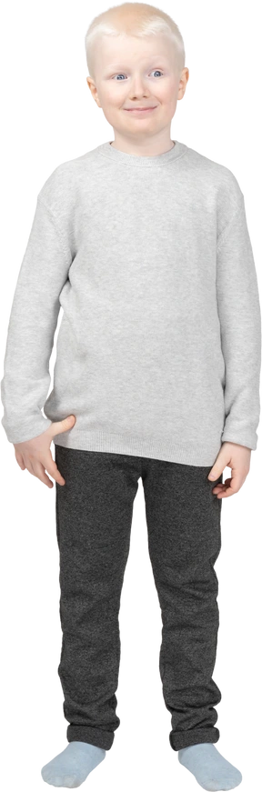 Close-up a funny little shy boy in casual clothes looking aside