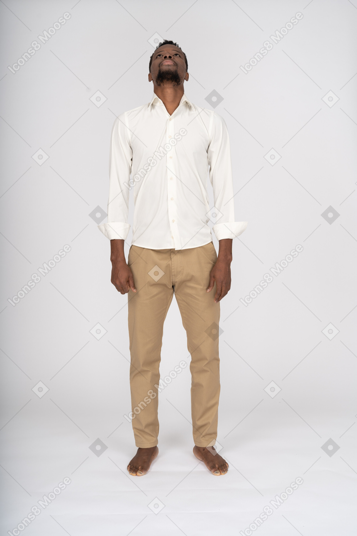 Man in white shirt standing