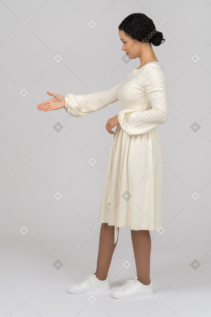 Young woman offering her hand sideways