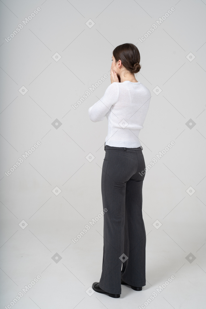 Back view of a worried woman