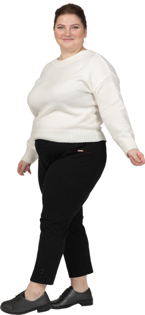 Happy plus size woman looking at camera