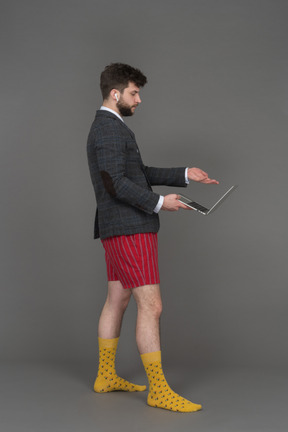 Man pointing to laptop screen with his hand