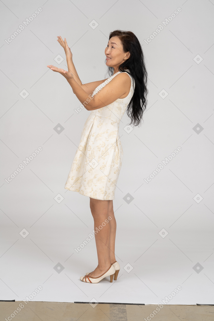 Woman in a white dress standing