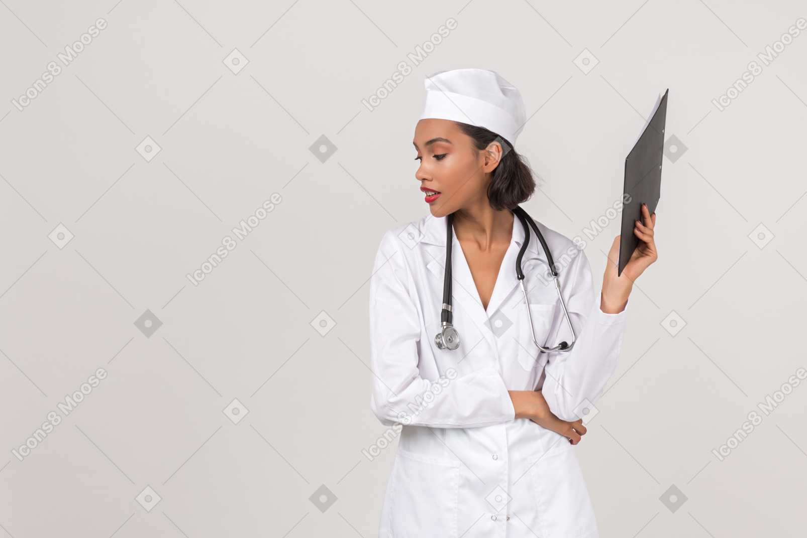 Attracive female doctor holding a chart holder