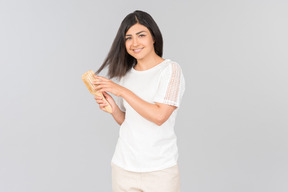 Young indian woman brushing her hair