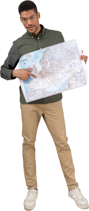 Front view of a man holding and pointing at a map