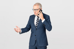 Elegant middle-aged man talking on the phone