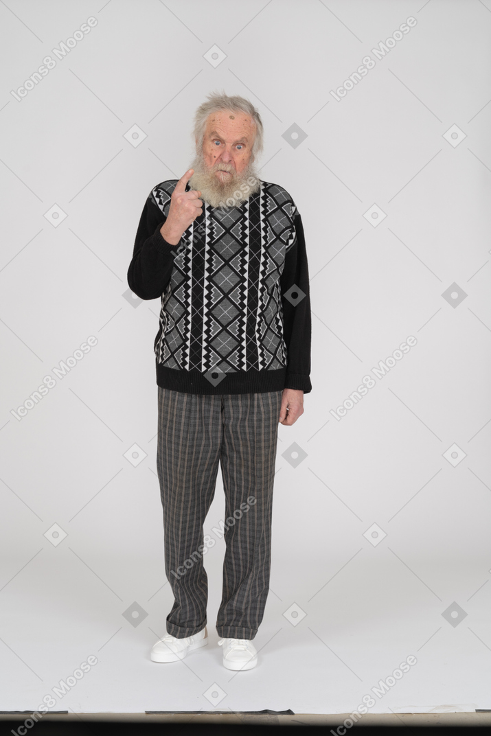 Old man scolding with finger
